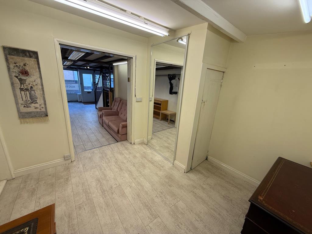 Lot: 52 - VACANT COMMERCIAL PREMISES - RETAIL OR STUDIO UNIT - Back of shop area with Cloakroom/WC